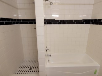 Bathroom with 2 showers