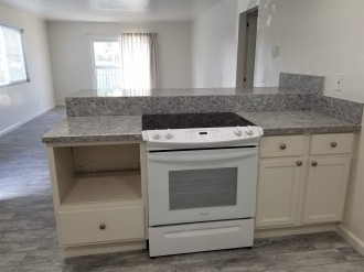 Kitchen with Microwave Cabinet and Bar