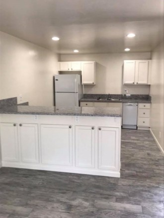 Kitchen with Bar and built in Microwave cabinet
