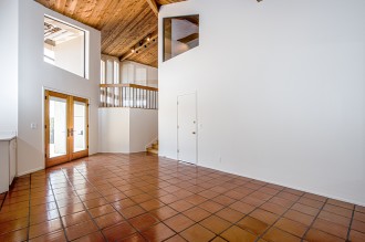 Dining Area with access to patio and upstairs TV Room and Study Nook